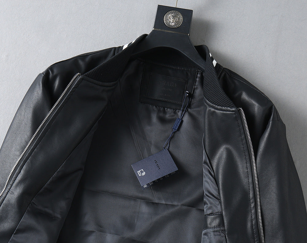 Black leather jacket with front zipper and interior label tag