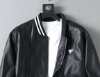 Black leather jacket front with stand collar, striped trim, zipper, and triangular logo