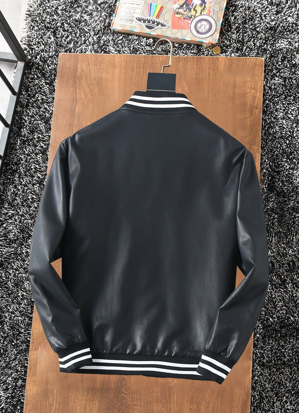 Prada leather jacket back view with striped ribbed hem cuffs