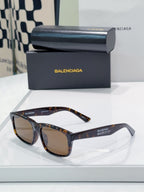 Sunglasses with brown tortoiseshell frame and dark lenses