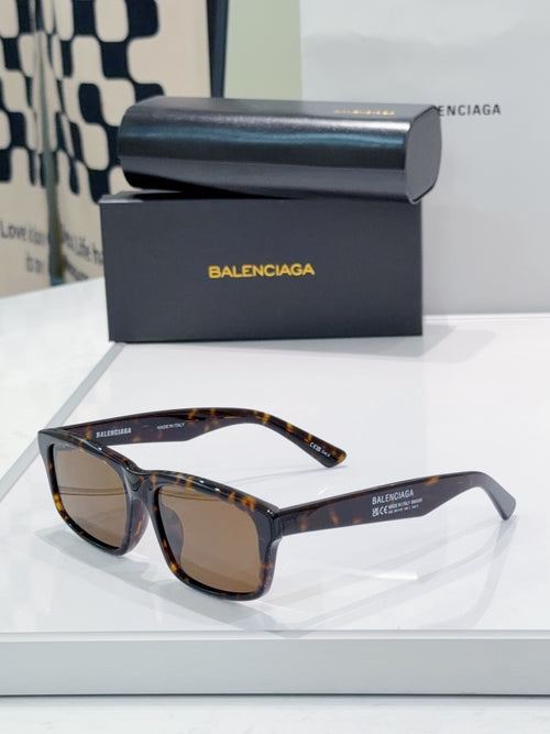 Sunglasses with brown tortoiseshell frame and dark lenses