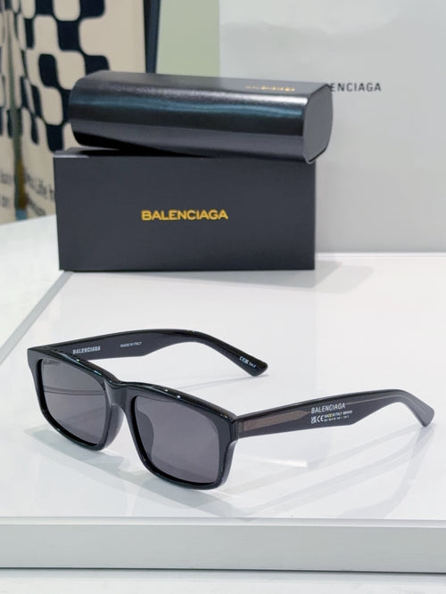 Balenciaga sunglasses with dark gray lenses and black frame
