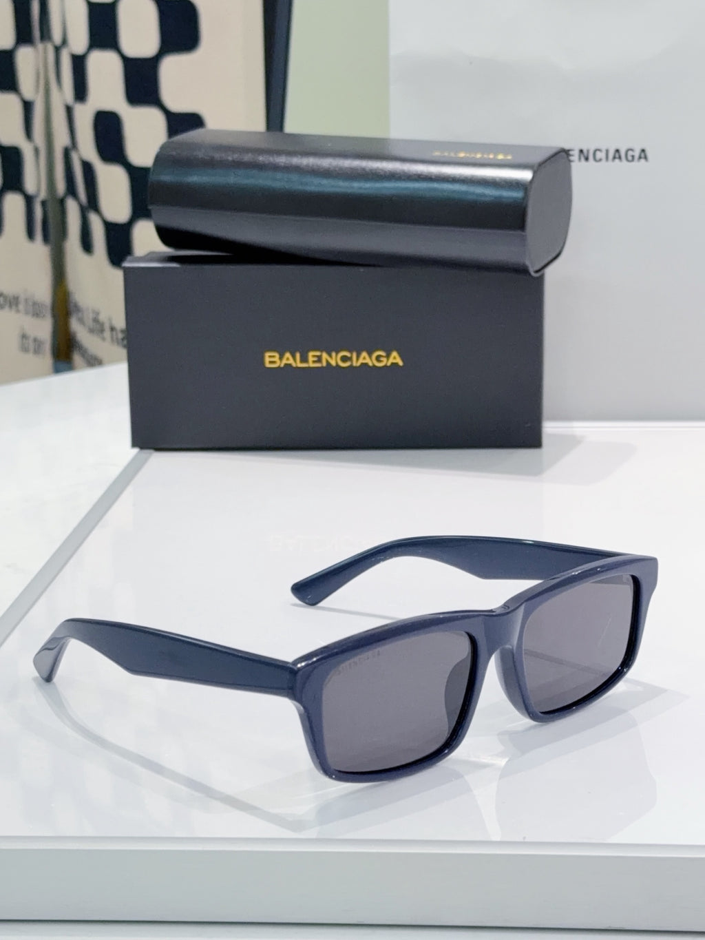 Sunglasses with blue frame and dark lenses