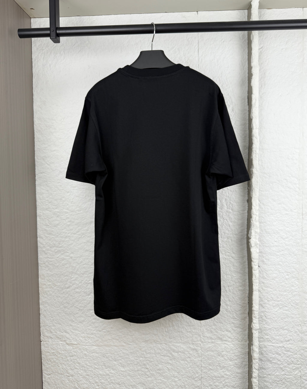 Black short-sleeve crewneck T-shirt, plain back view