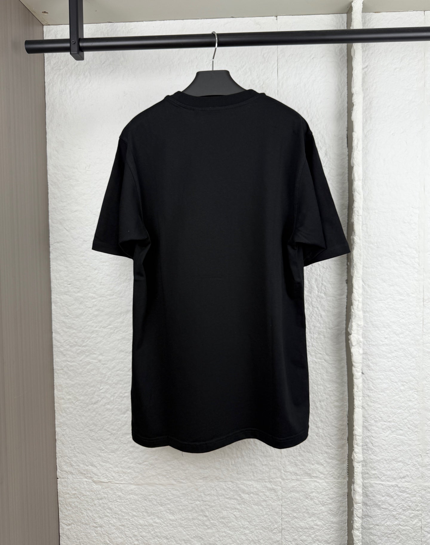 Black short-sleeve crewneck T-shirt, plain back view