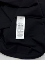 Black crewneck T-shirt with white label at inner neckline