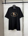 Black short-sleeve crewneck T-shirt with oval logo graphic at chest