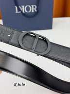 Dior belt buckle detail with dark gray pebble-grain leather keeper