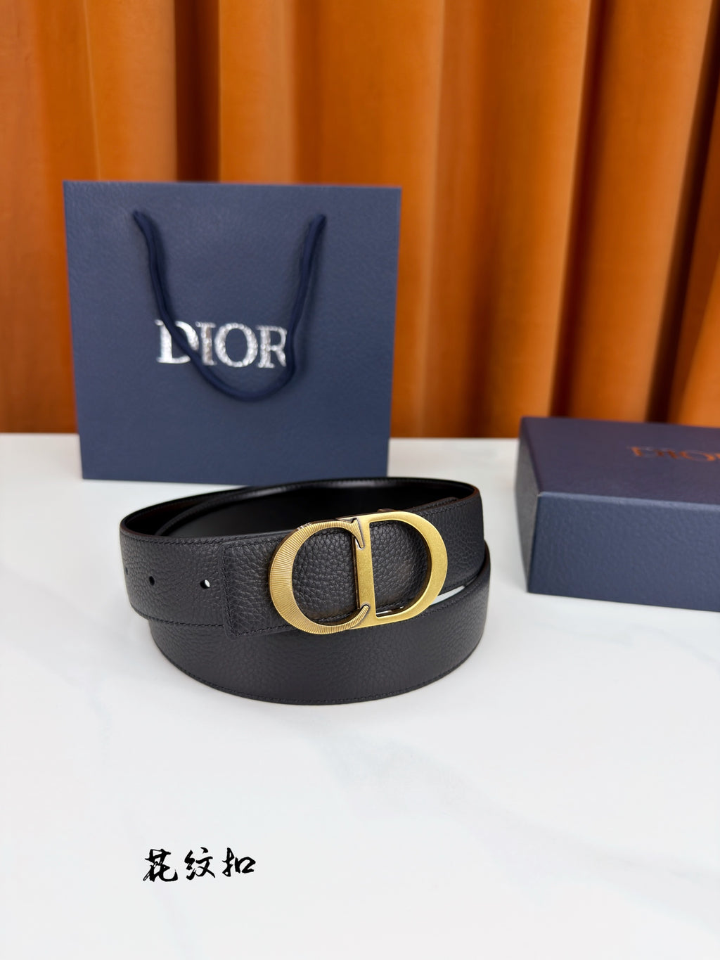 Dior belt in dark leather with gold CD buckle front view.