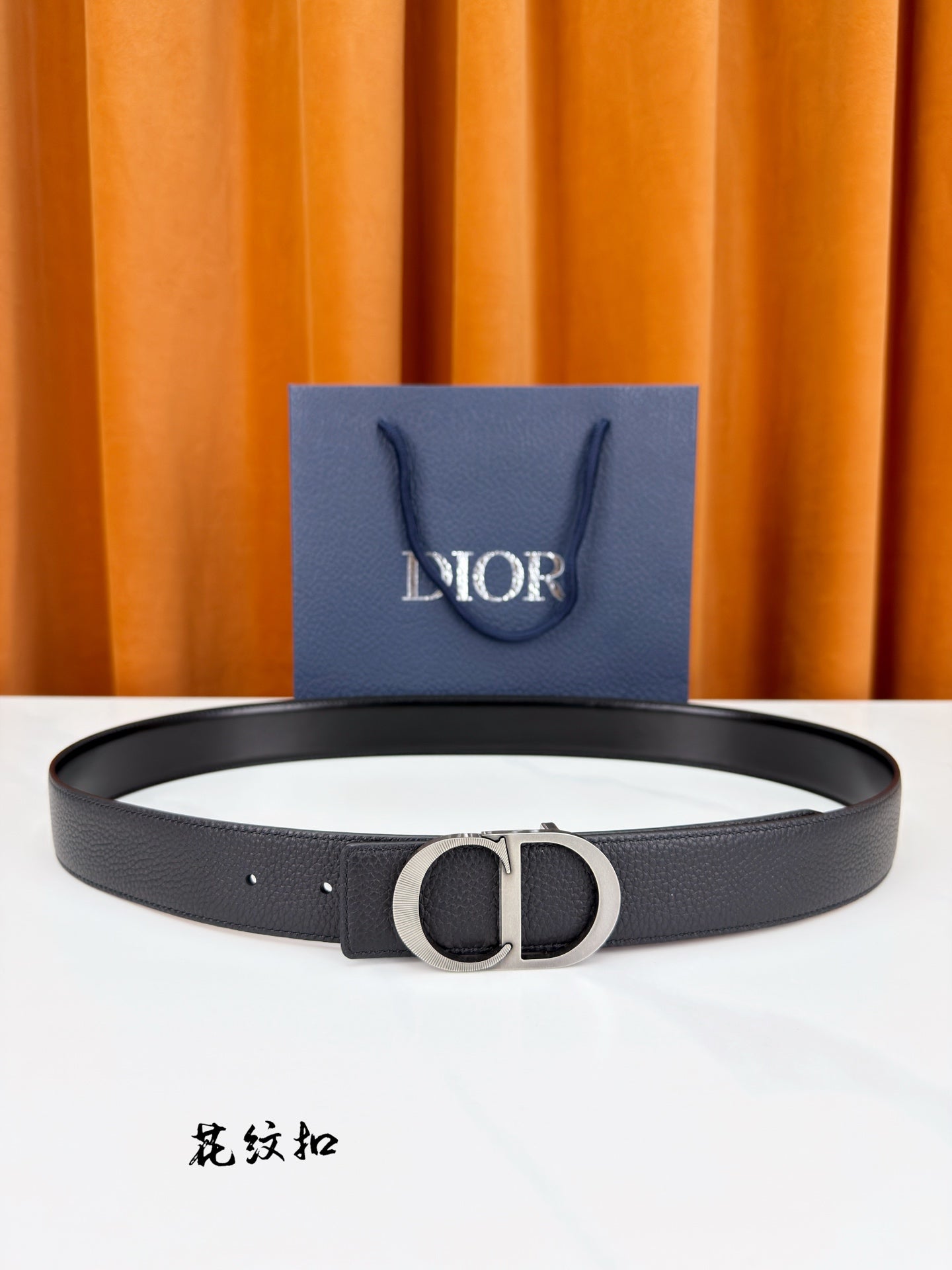 Dior belt in dark leather with silver CD buckle detail.