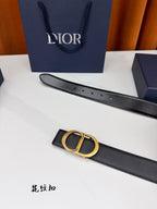 Dior belt side view: dark leather strap with gold CD buckle and holes.
