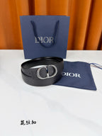 Dior belt in dark leather with silver-tone D buckle and blue dust bag