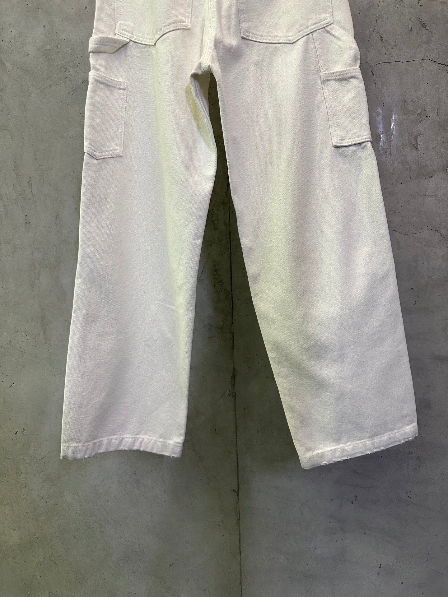 Prada white cargo pants with side cargo pockets and wide leg