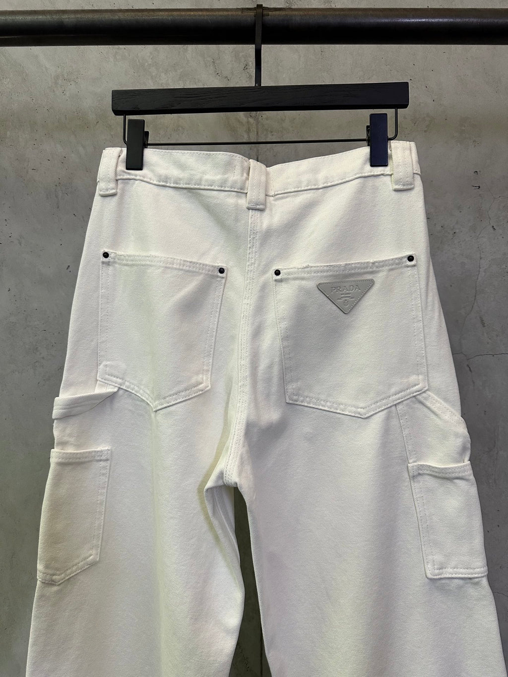 Prada white cargo pants with waistband button and triangular logo patch