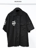 Balenciaga black short-sleeve button-up shirt with chest patch pocket and logo print