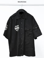 Balenciaga black short-sleeve button-up shirt with chest patch pocket and logo print