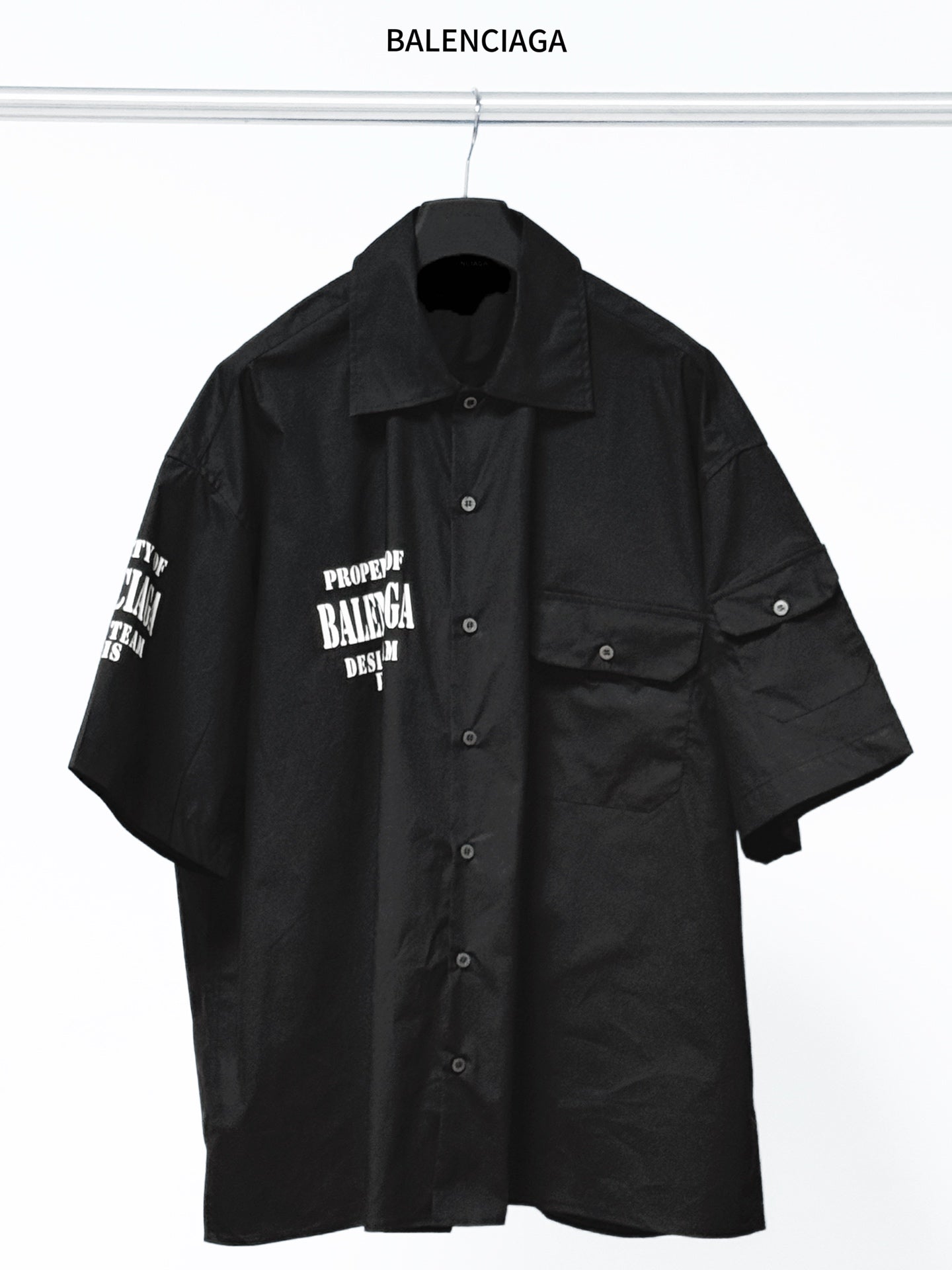 Balenciaga black short-sleeve button-up shirt with chest patch pocket and logo print