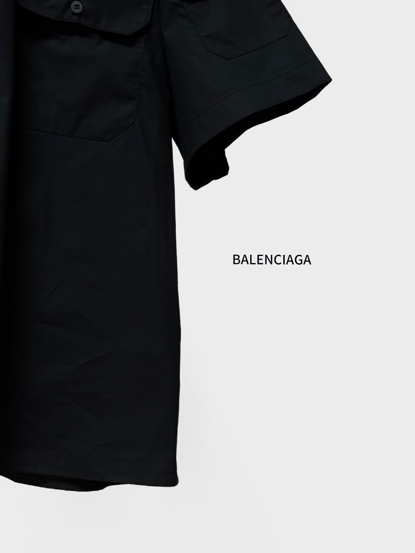Balenciaga black short-sleeve shirt hem with button-down placket and sleeve cuff