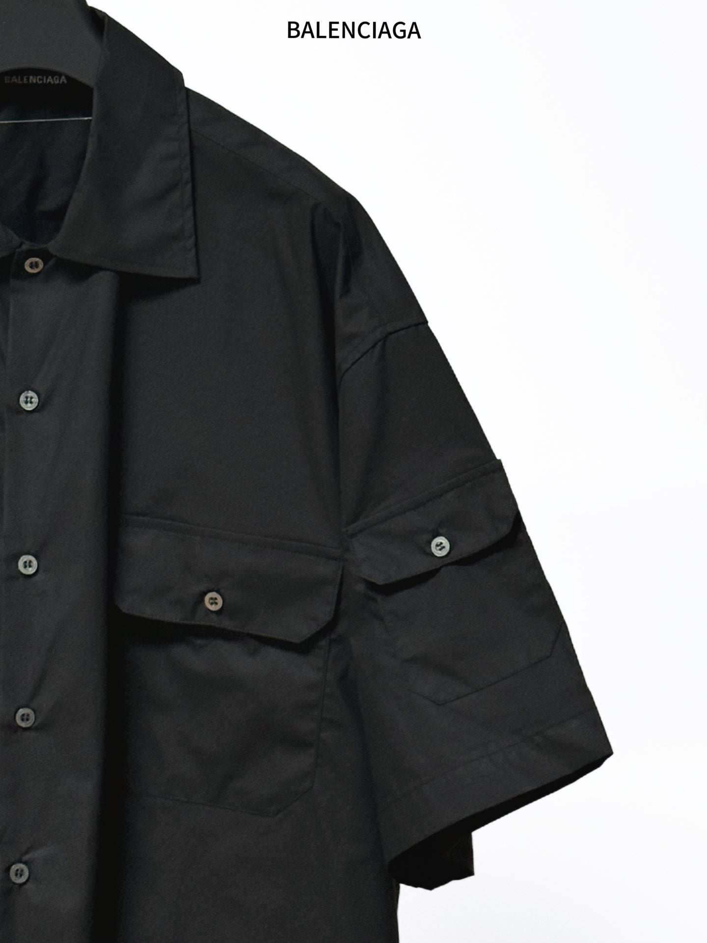Balenciaga black short-sleeve shirt with front pocket panel and sleeve seam detail