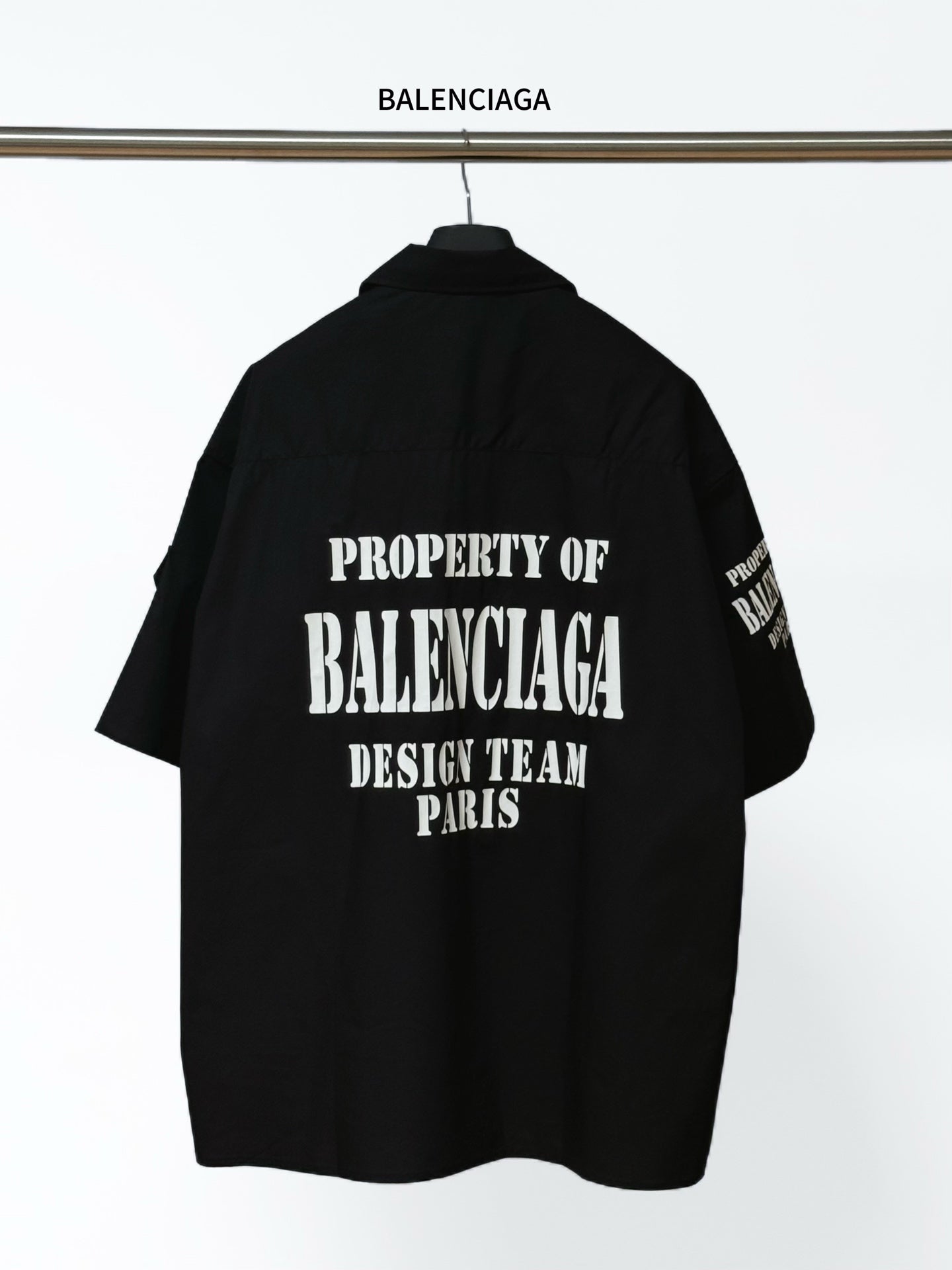 Balenciaga black short-sleeve shirt, back features large “PROPERTY OF BALENCIAGA” graphic