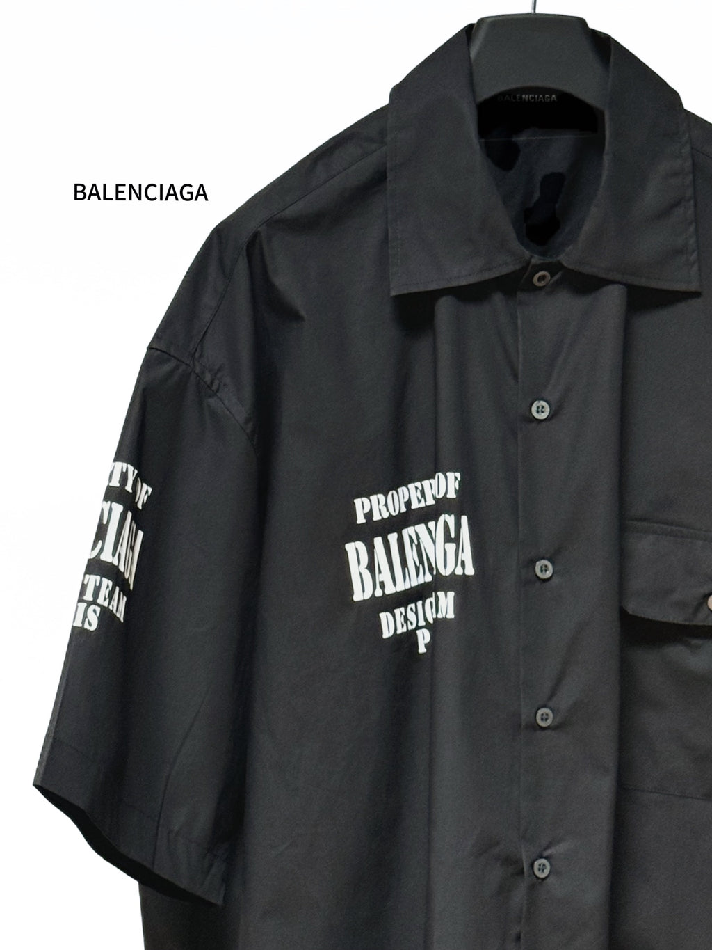 Balenciaga black short-sleeve button-up shirt with pointed collar and front logo print