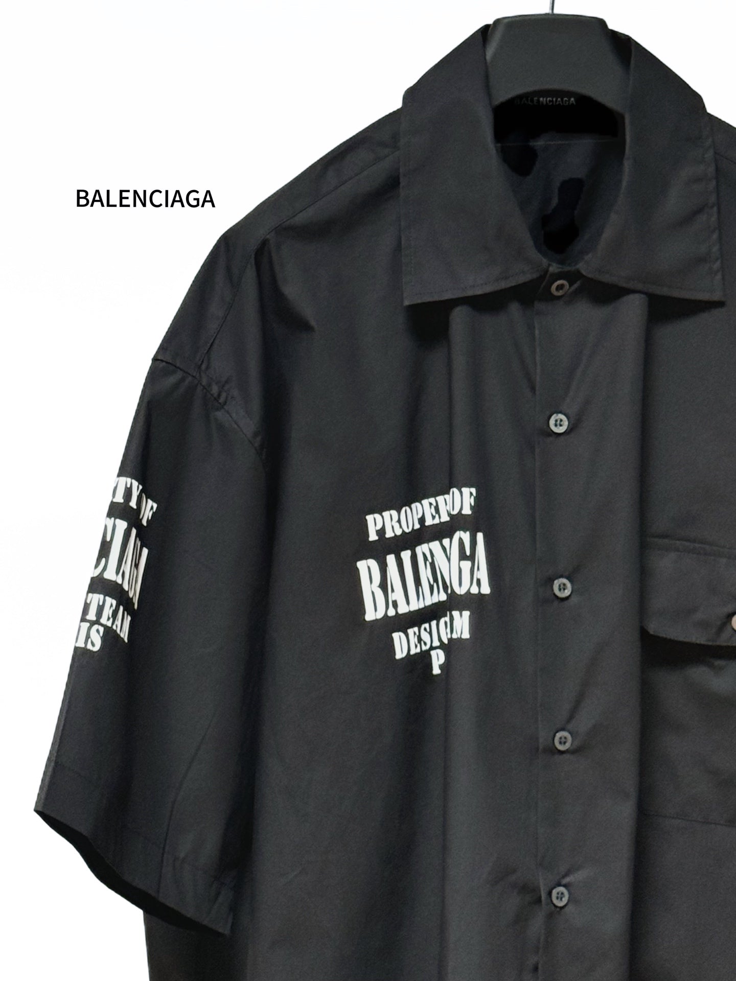 Balenciaga black short-sleeve button-up shirt with pointed collar and front logo print