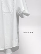 Balenciaga white short-sleeve shirt lower side view with hem and stitched seam