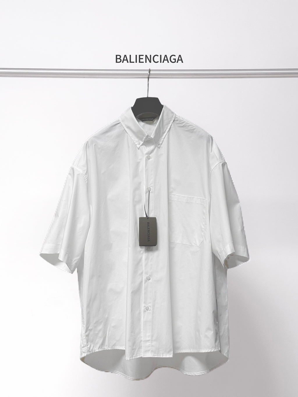 Balenciaga white short-sleeve button shirt with pointed collar and chest pocket