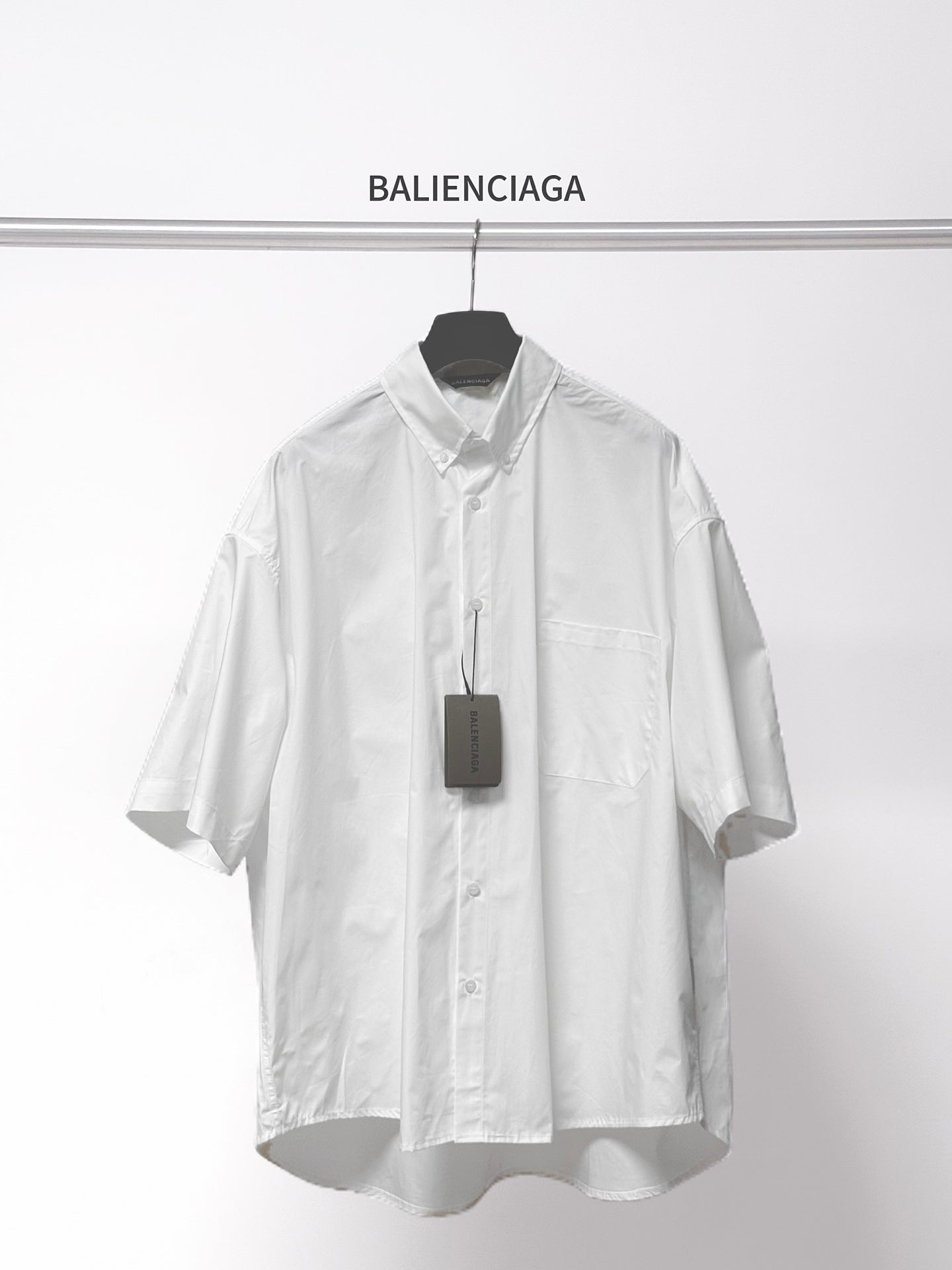 Balenciaga white short-sleeve button shirt with pointed collar and chest pocket