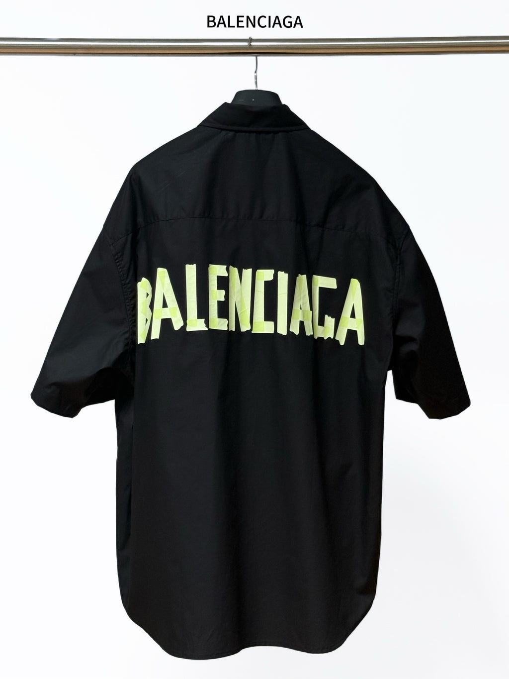 Men's short-sleeve button-up shirt, black, with neon BALENCIAGA logo print on back