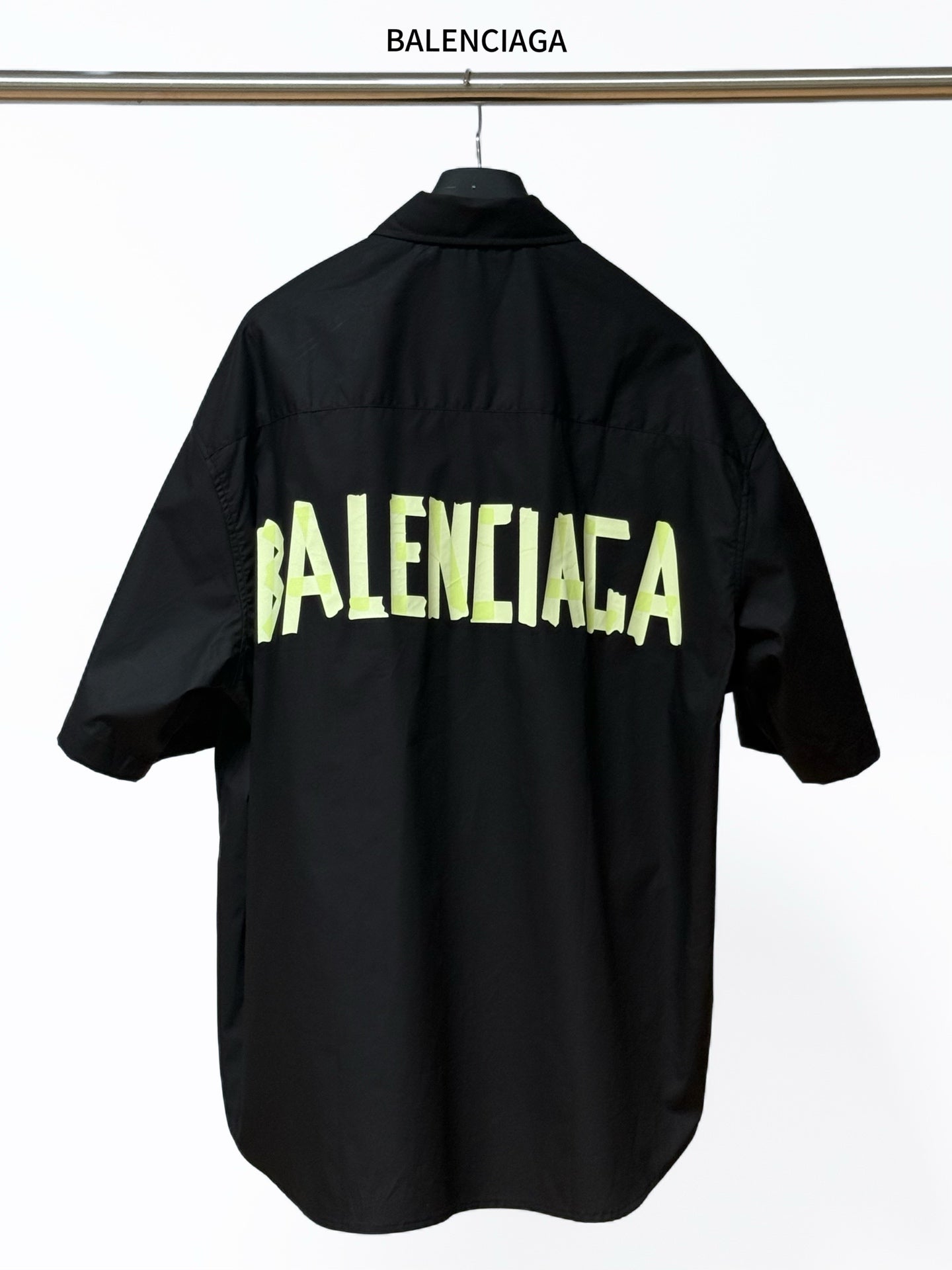 Men's short-sleeve button-up shirt, black, with neon BALENCIAGA logo print on back