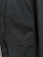 Men's short-sleeve button-up shirt, black, close-up of chest pocket