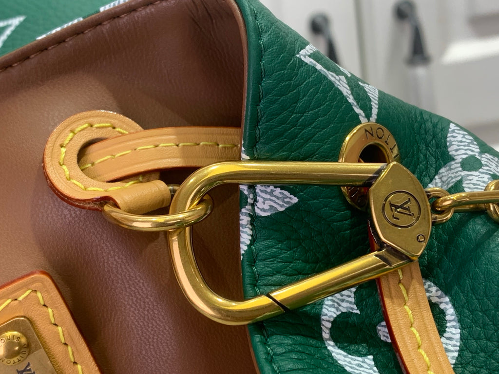 Louis Vuitton bag metal clasp with green leather strap and gold hardware