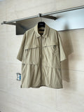 Beige short-sleeve utility jacket with pointed collar and front zipper