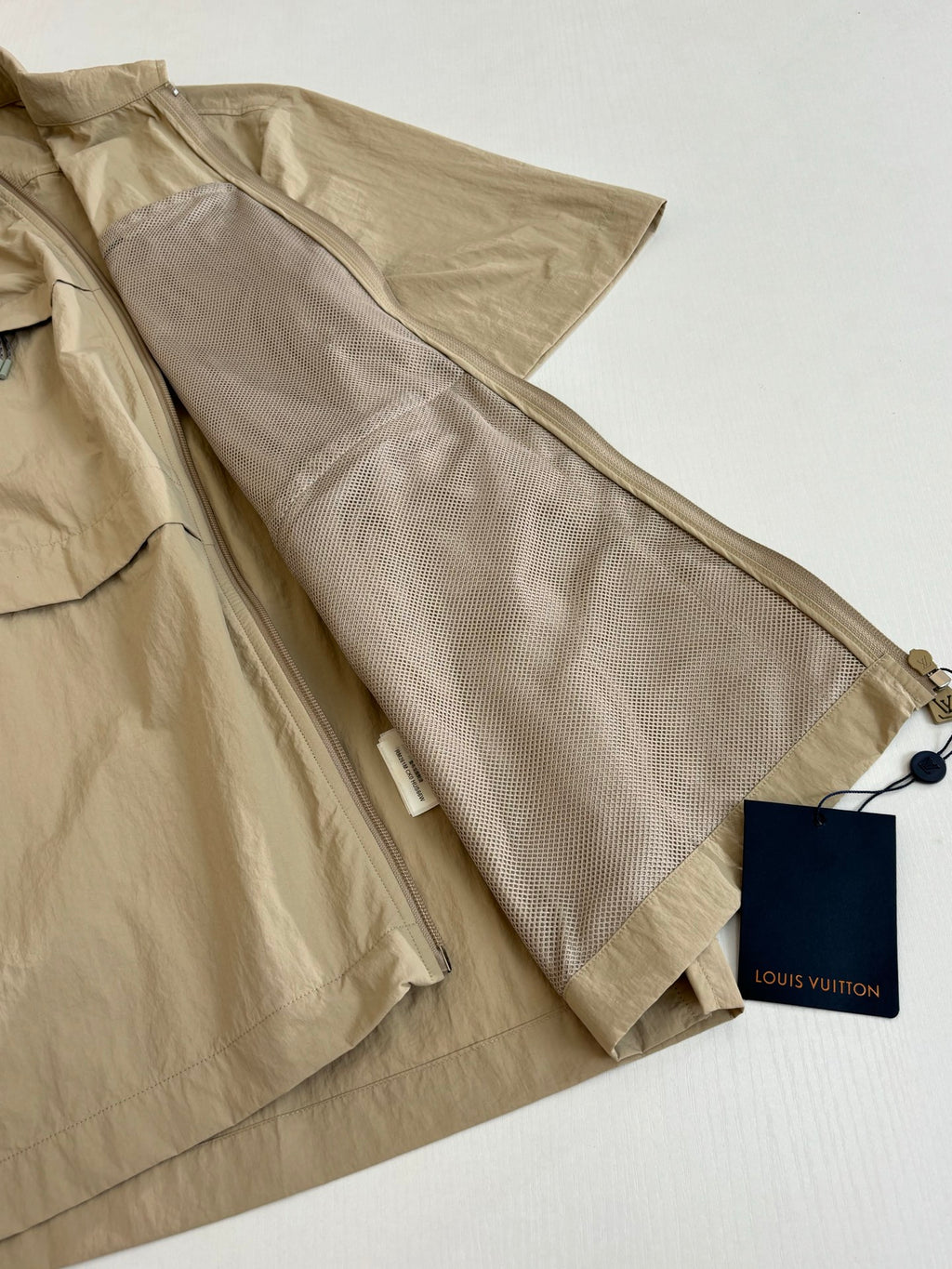 Beige Louis Vuitton shorts with zip fly and tag