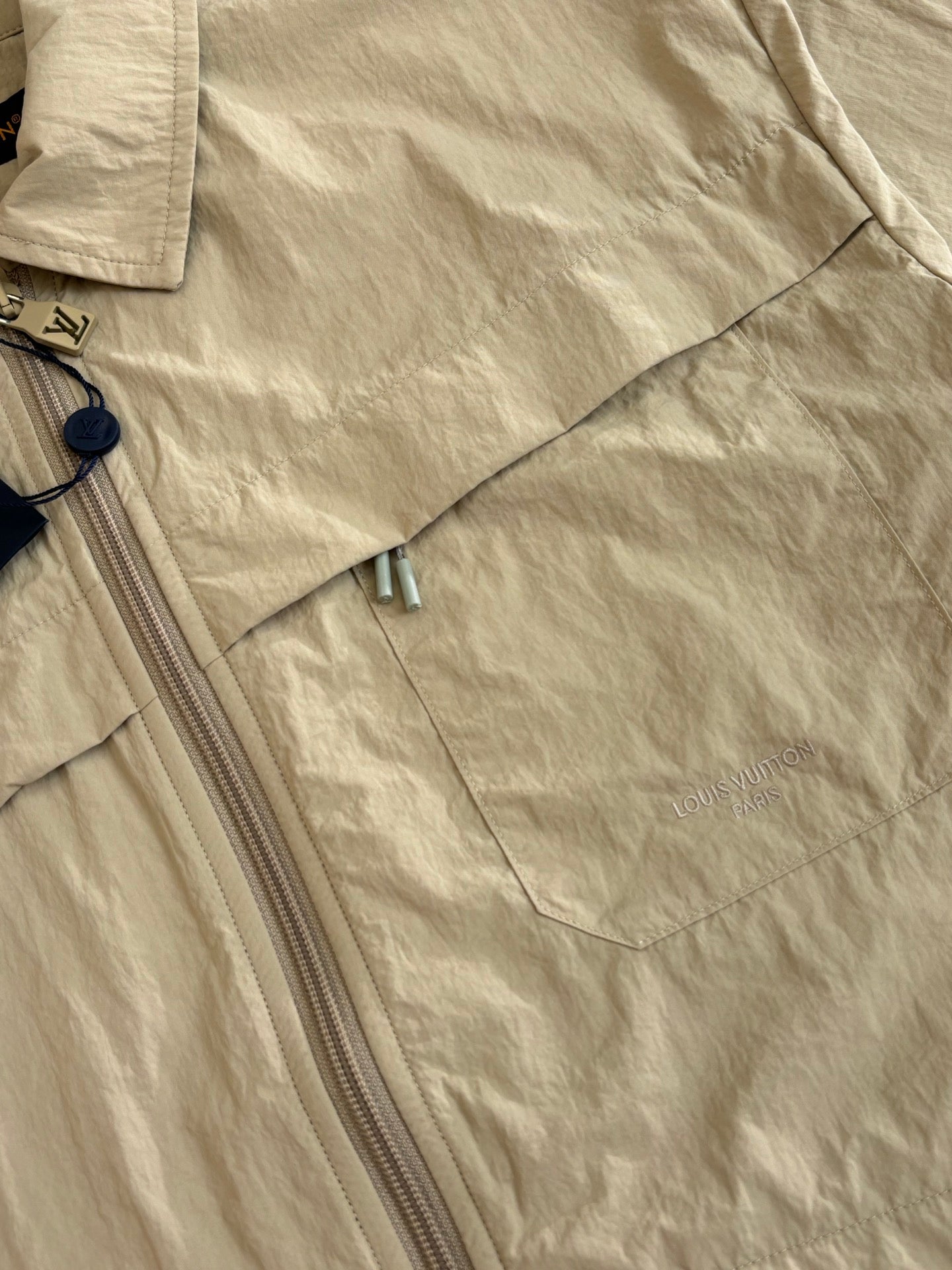 Beige Louis Vuitton jacket with zip front and small chest logo detail