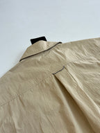 Beige Louis Vuitton shorts with side seam and flap detail