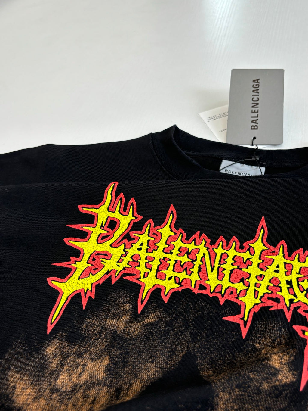 Balenciaga black T-shirt neon logo star graphic, close-up front