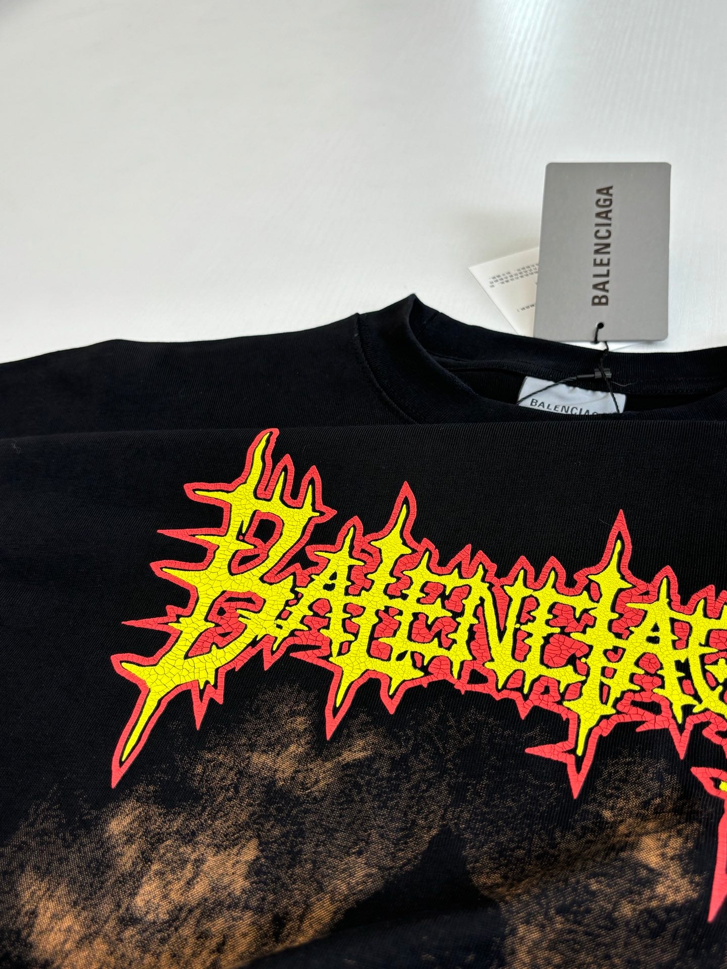 Balenciaga black T-shirt neon logo star graphic, close-up front