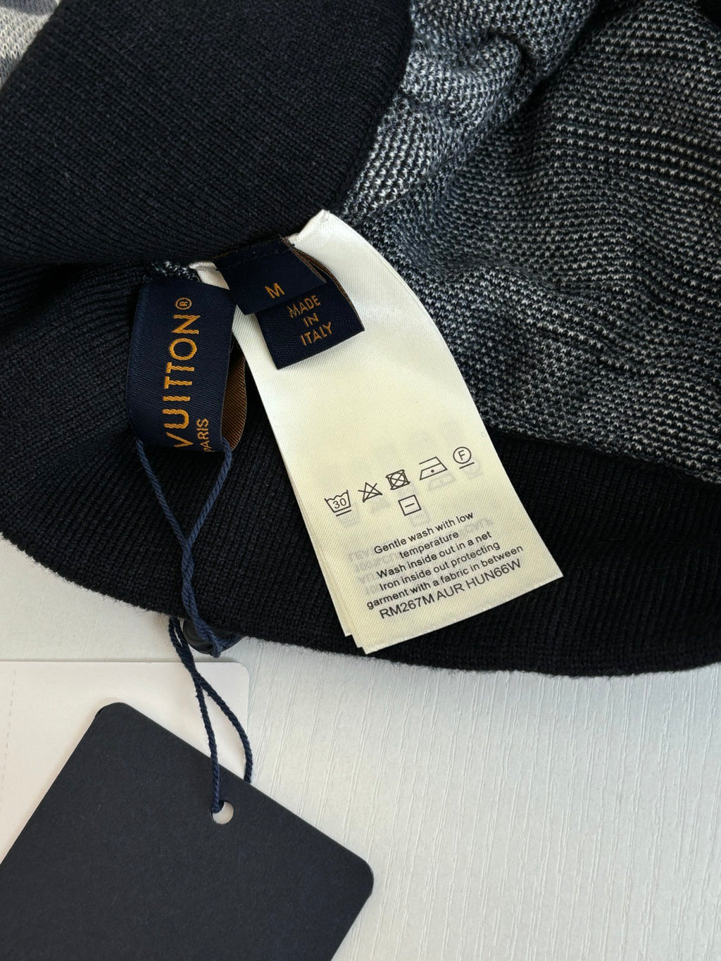 Dark Louis Vuitton pants with waistband and attached fabric care label