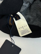 Dark Louis Vuitton pants with waistband and attached fabric care label