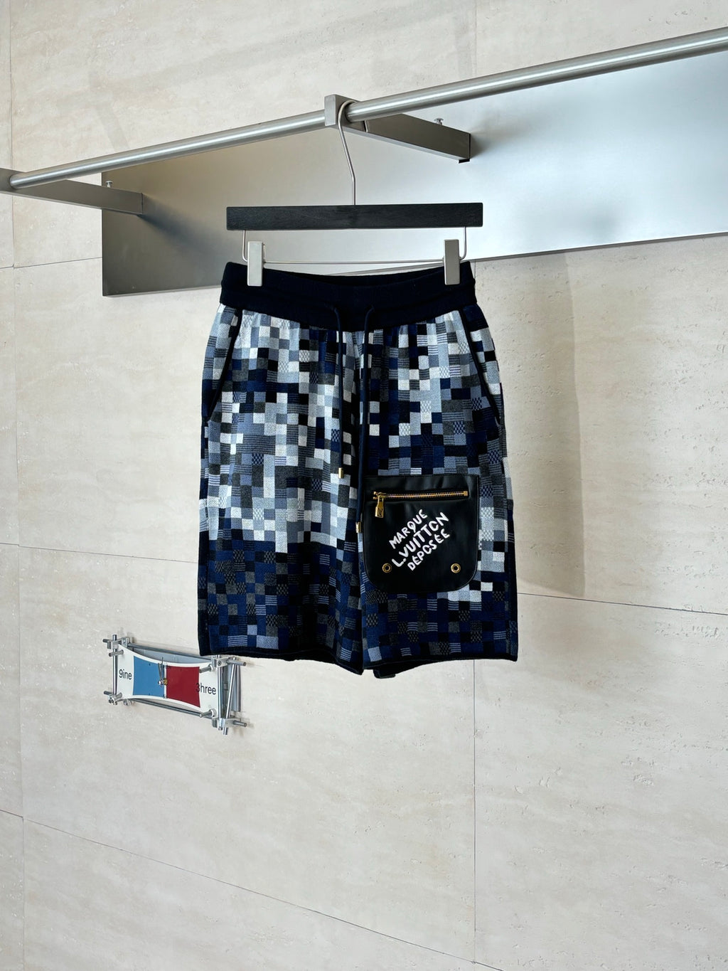 Louis Vuitton checkered shorts, dark blue and light gray, with side patch pocket