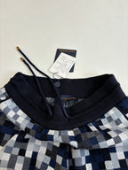 Louis Vuitton shorts neckline detail with black drawstring waistband and size tag