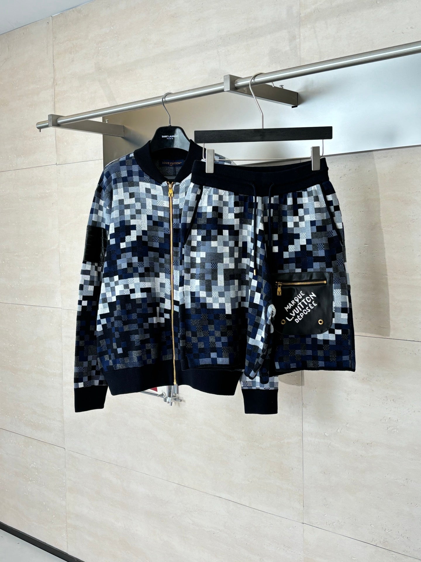 Louis Vuitton shorts set on hangers, check pattern with black waistband and label pocket