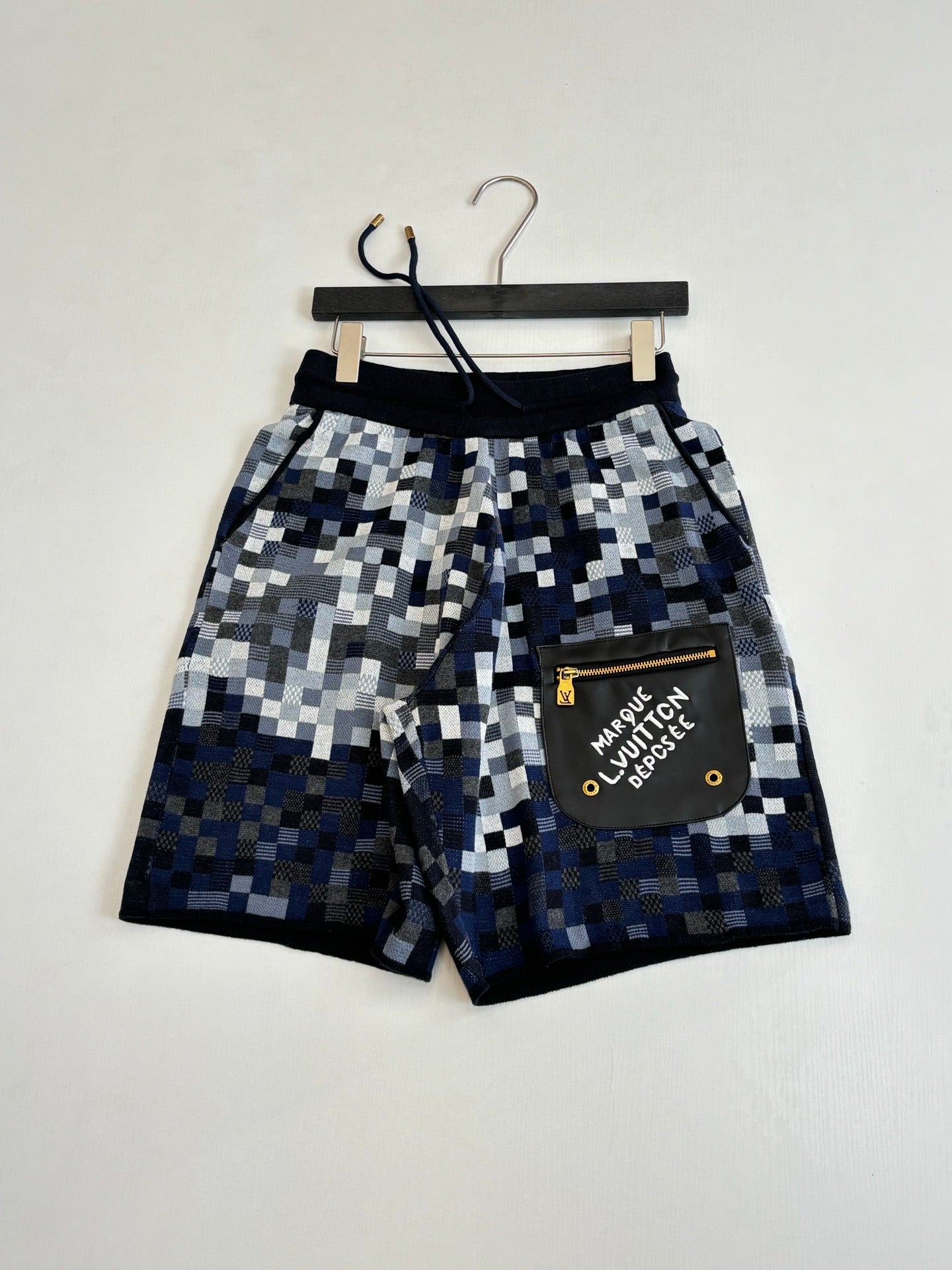 Louis Vuitton checkered shorts with black drawstring and front patch logo pocket