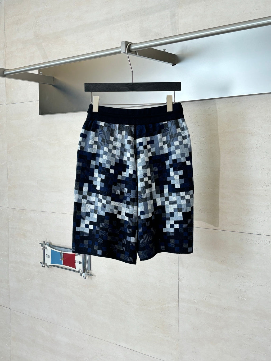 Louis Vuitton checkered shorts on hanger, dark blue and gray with elastic waistband