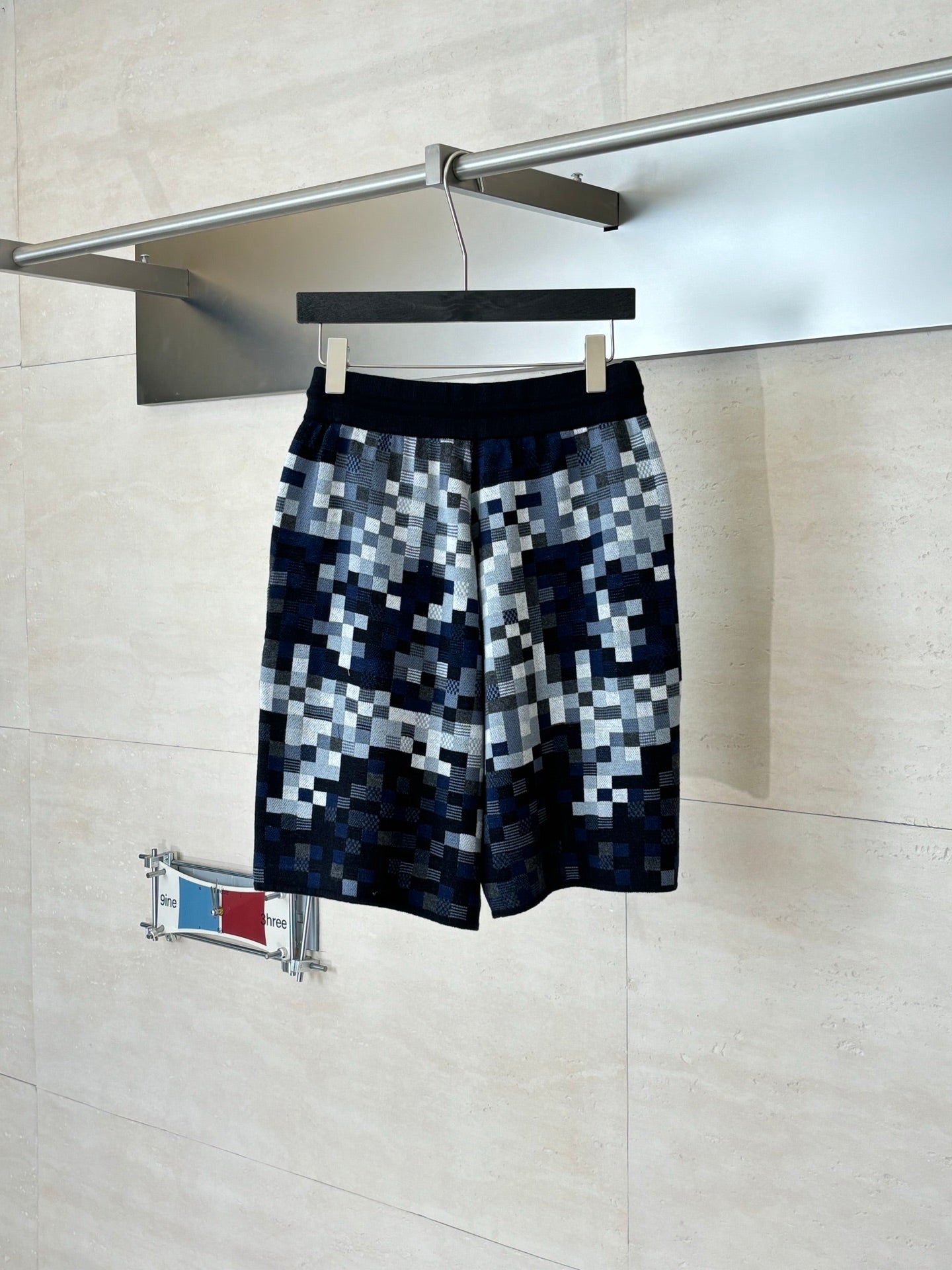 Louis Vuitton checkered shorts on hanger, dark blue and gray with elastic waistband