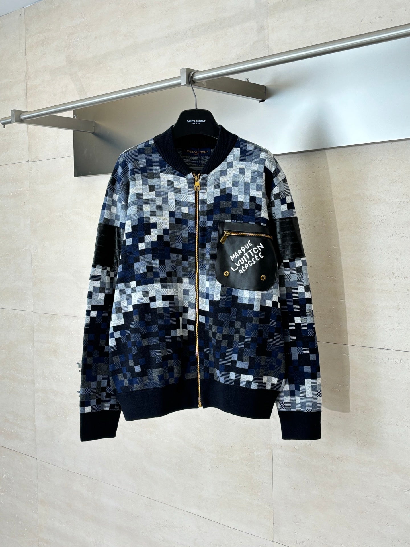 Long-sleeve zip sweater jacket in blue and white pixel check with black rib trim