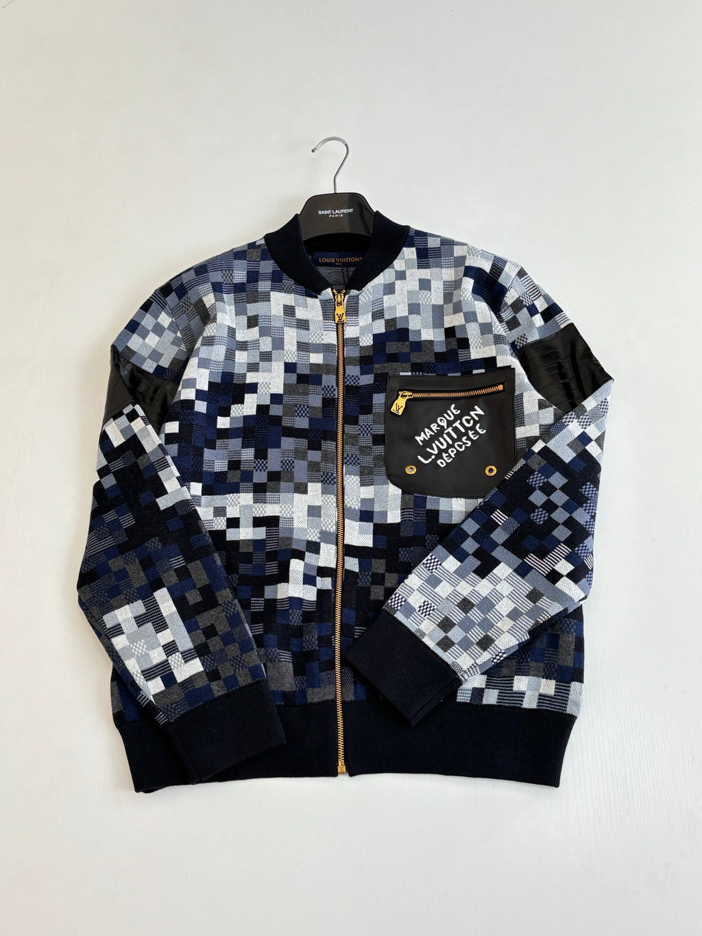 Blue and white checker knit zip sweater jacket with chest patch and ribbed cuffs