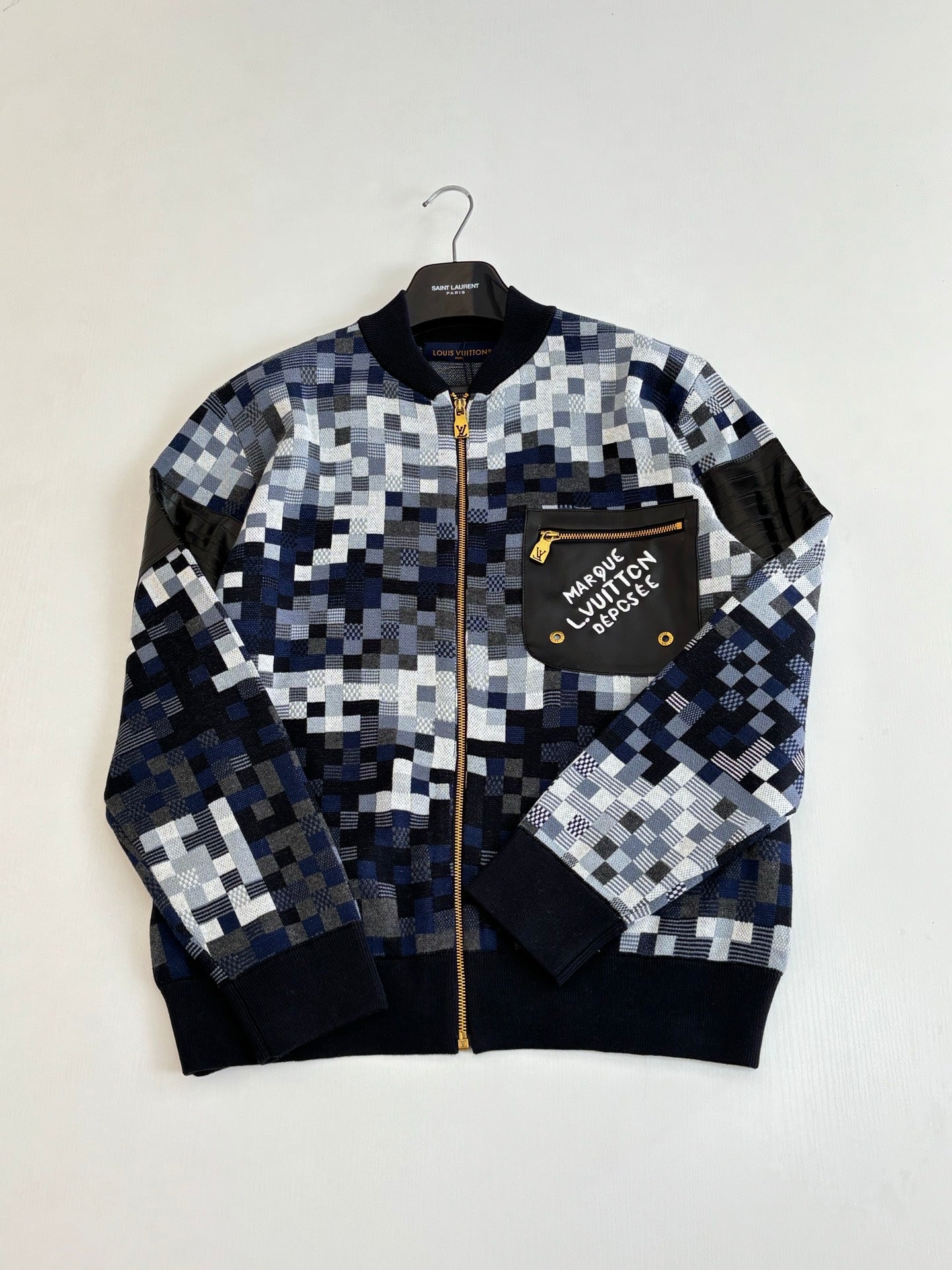 Blue and white checker knit zip sweater jacket with chest patch and ribbed cuffs
